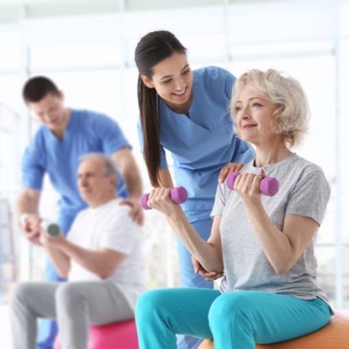 Old people exercising with therapists