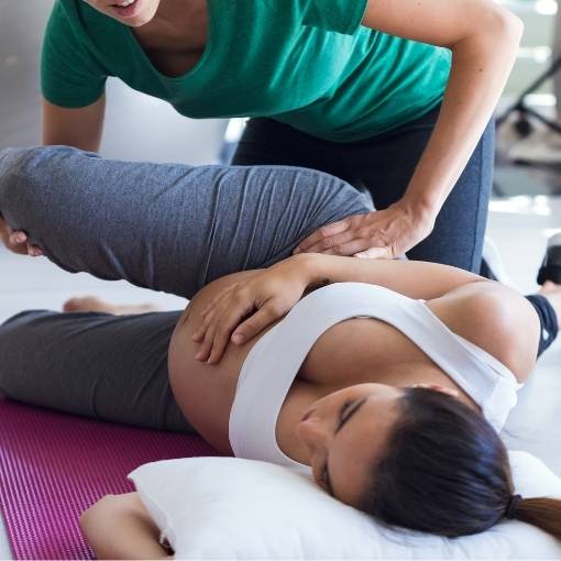 Chiropractor with pregnant woman